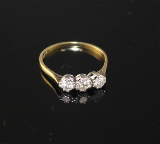 An 18ct and Plat, three stone diamond ring, size P, gross weight 1.8 grams,